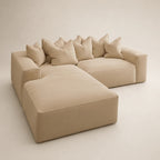 Beige luxury sectional sofa with plush cushions and chaise lounge, modern living room furniture