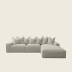 Luxury grey sectional sofa with chaise lounge and plush pillows, modern living room furniture