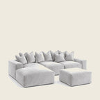 Luxury gray sectional sofa with plush cushions and matching ottoman for modern living rooms