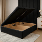 Black storage bed frame with lift-up mechanism, showing spacious wooden interior for bedroom storage