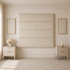 Luxury beige upholstered headboard with matching nightstands in elegant bedroom setting