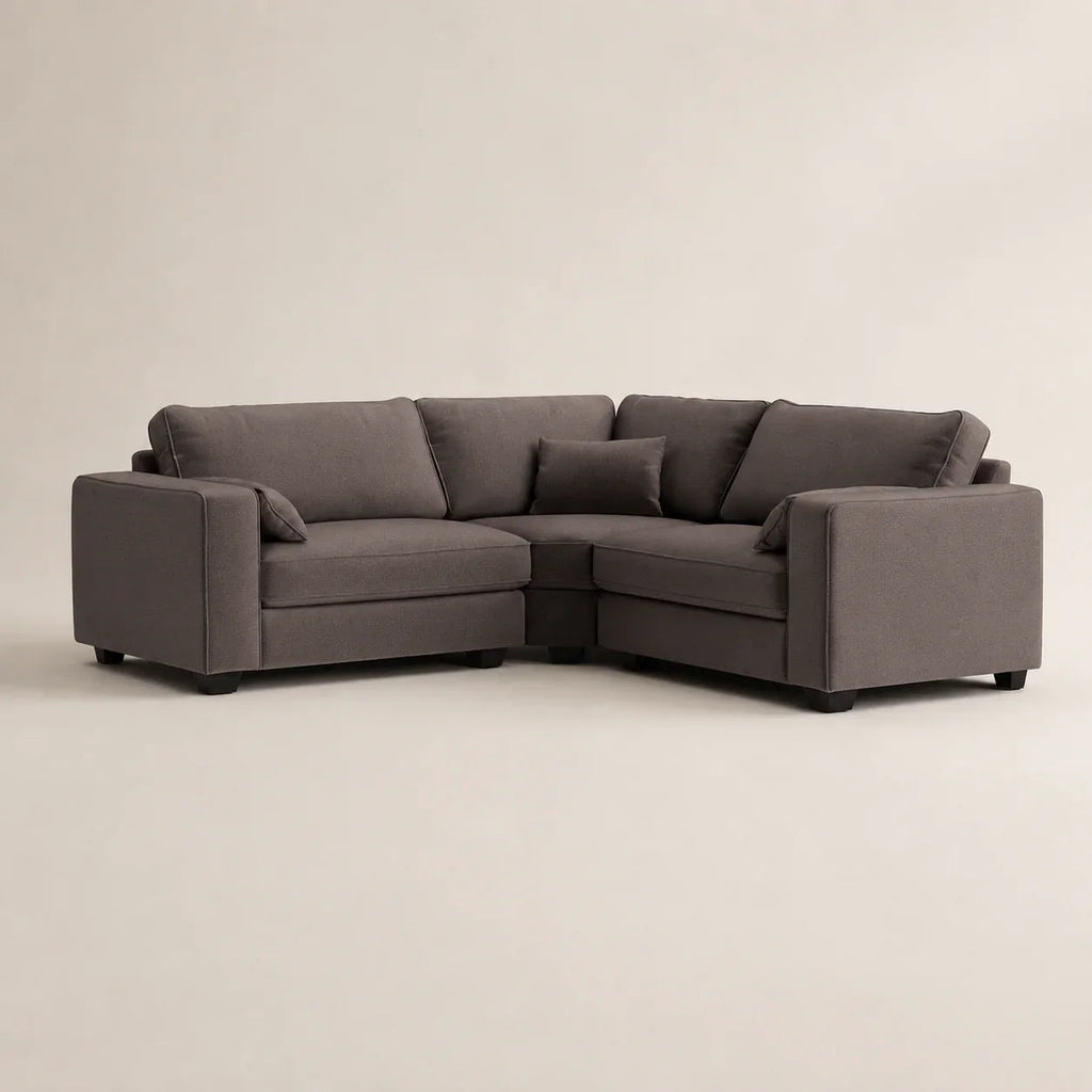 Modern grey L-shaped sectional sofa with plush cushions, ideal for luxury living rooms