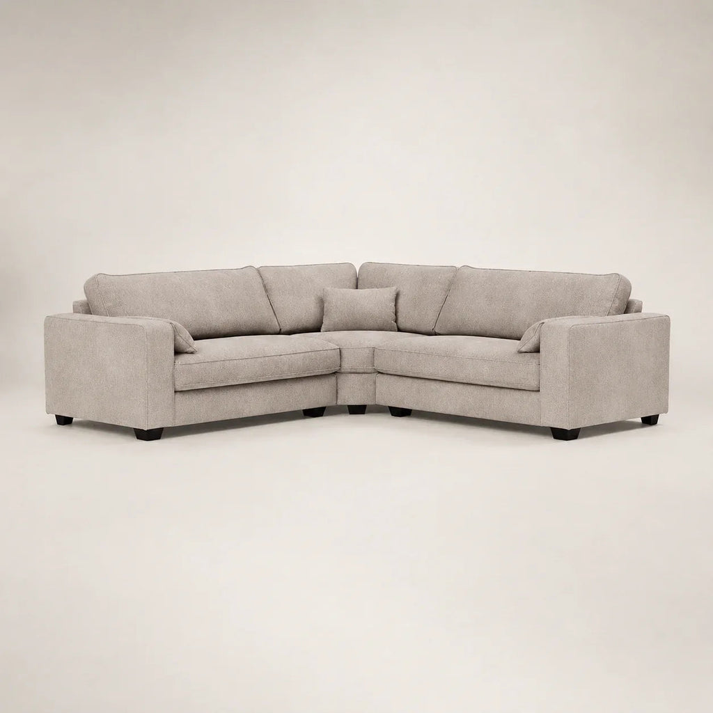 Modern grey L-shaped sectional sofa with plush cushions and dark legs, ideal for luxury living rooms