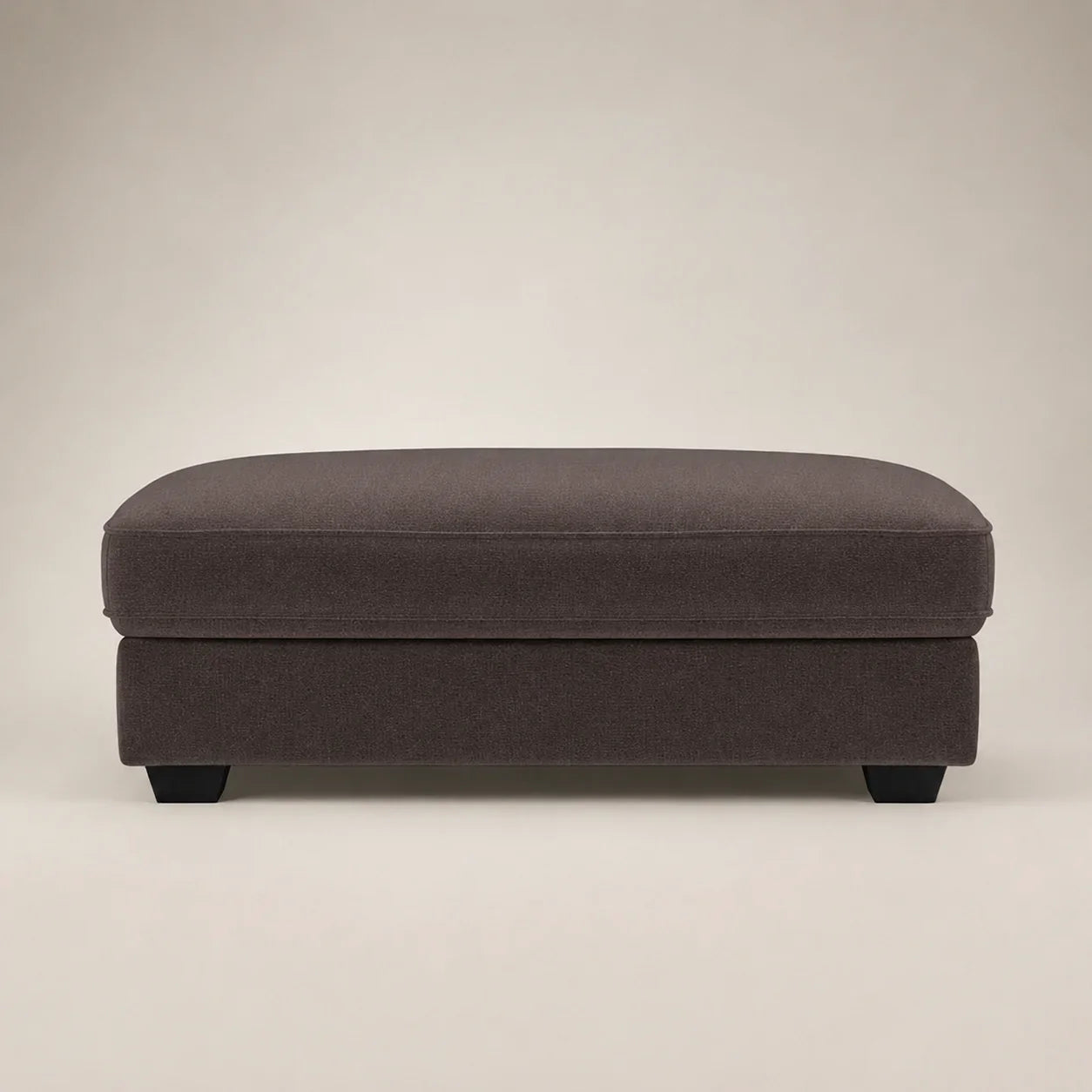 Dark grey fabric ottoman with black feet, modern luxury living room furniture