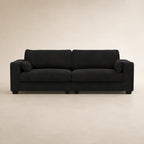 Black fabric sofa with two cushions and matching pillows, modern living room furniture
