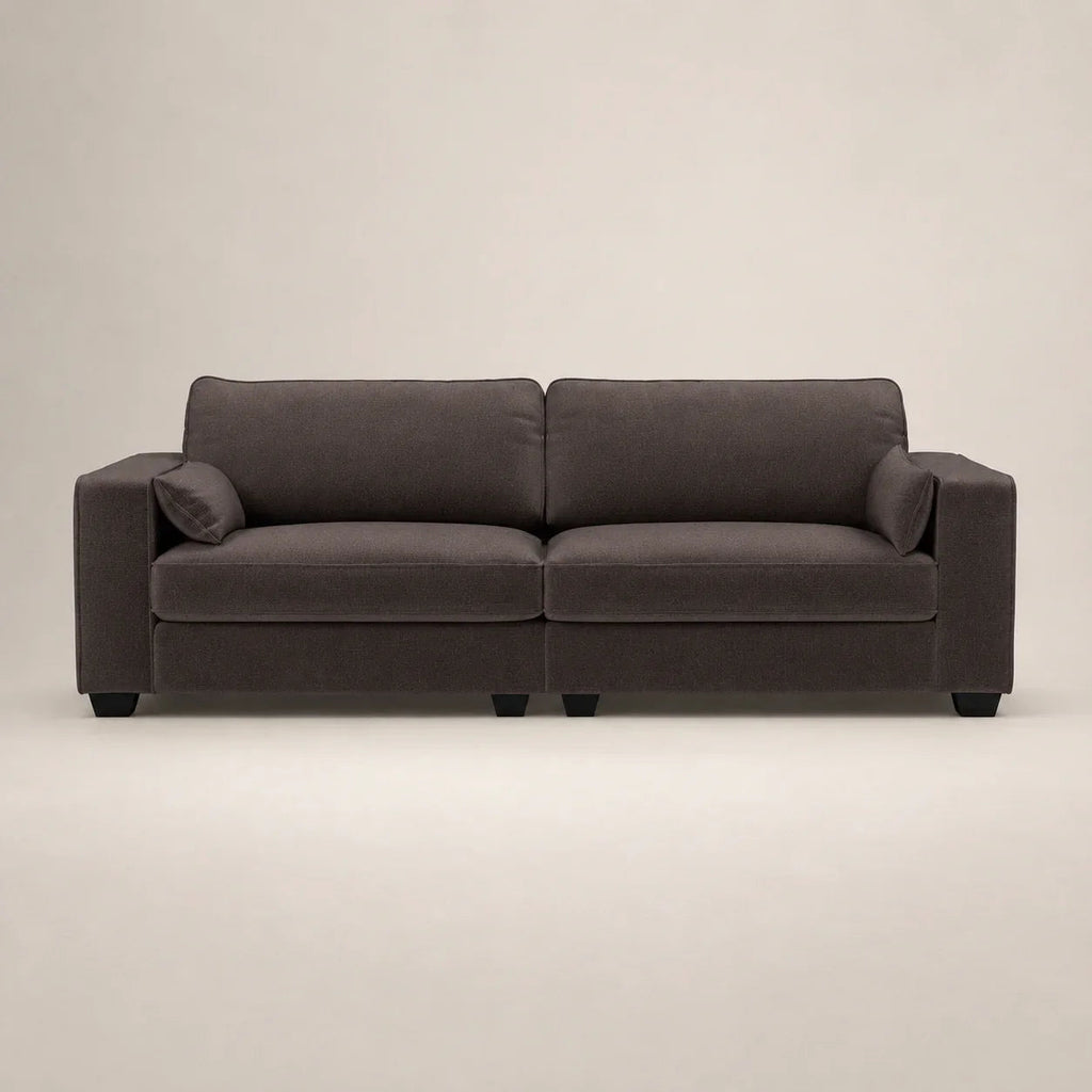 Dark gray modern sofa with plush cushions and black legs, ideal for luxury living rooms