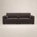 Dark gray modern sofa with plush cushions and black legs, ideal for luxury living rooms