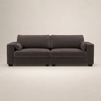 Dark gray modern sofa with plush cushions and black legs, ideal for luxury living rooms