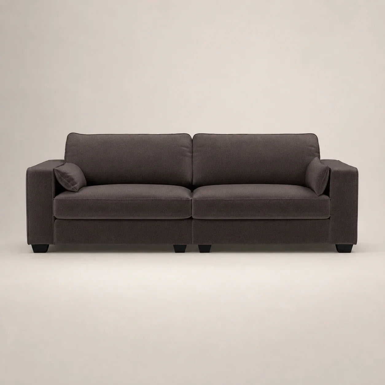 Dark gray modern sofa with plush cushions and black legs, ideal for luxury living rooms