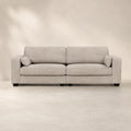 Luxury beige fabric sofa with plush cushions and black legs, ideal for modern living rooms