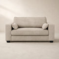 Beige fabric sofa with matching cushions, modern design for living room comfort