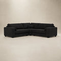 Black fabric corner sofa with plush cushions, modern design for luxury living rooms