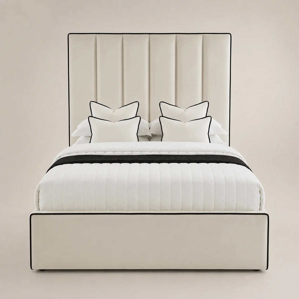 Luxury cream upholstered bed with black piping, white quilted bedding, and matching pillows for modern bedrooms