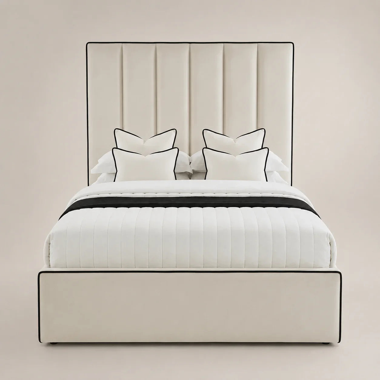 Luxury cream upholstered bed with black piping, white quilted bedding, and matching pillows for modern bedrooms